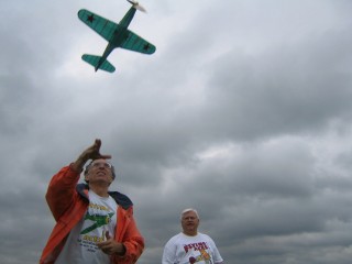 Men Flying a Model Plane